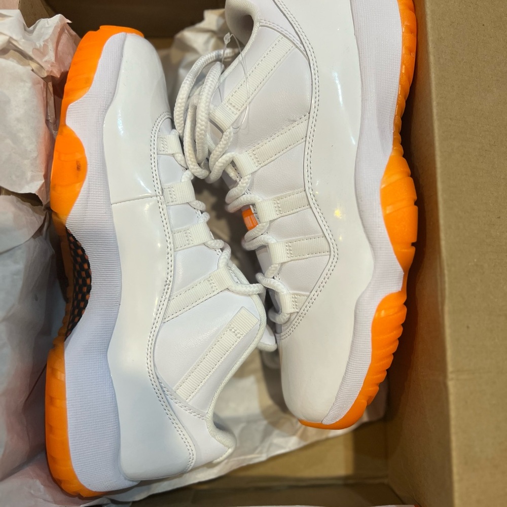 Orange and white Jordans. Women’s Size 9. Worn once. Like new.
